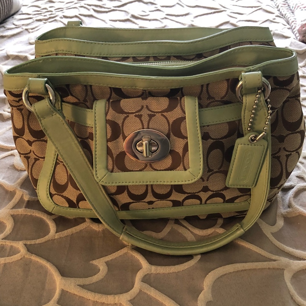 Green and tan Coach signature handbag